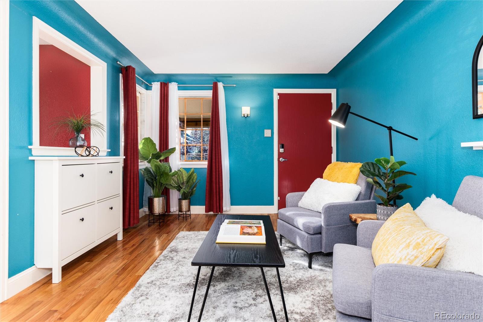3100 Ames Street Wheat Ridge, CO 80214 - Photo 8 of 39 a living room with furniture a rug and a window