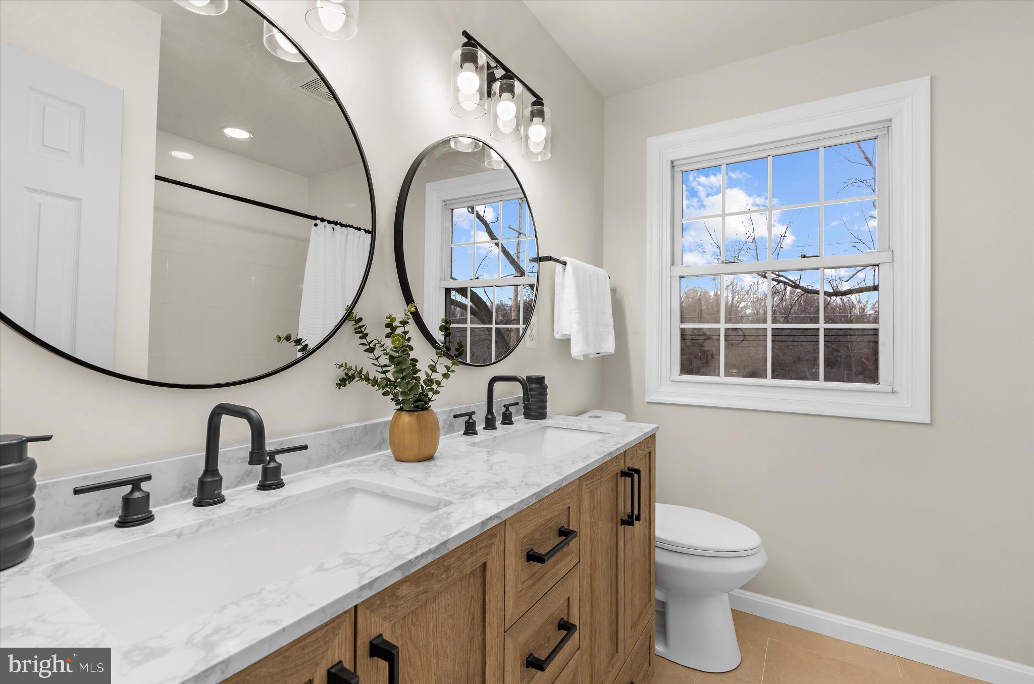 1125 Dorsey Road Hanover, MD 21076 - Photo 23 of 32 Modern elegance in a serene bathroom retreat.
