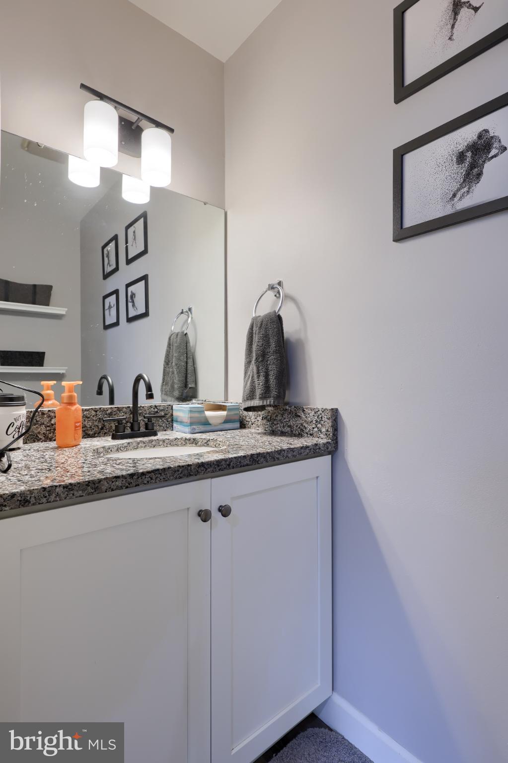 425 Cardinal Road Lititz, PA 17543 - Photo 22 of 33 a bathroom with a granite countertop sink and a mirror