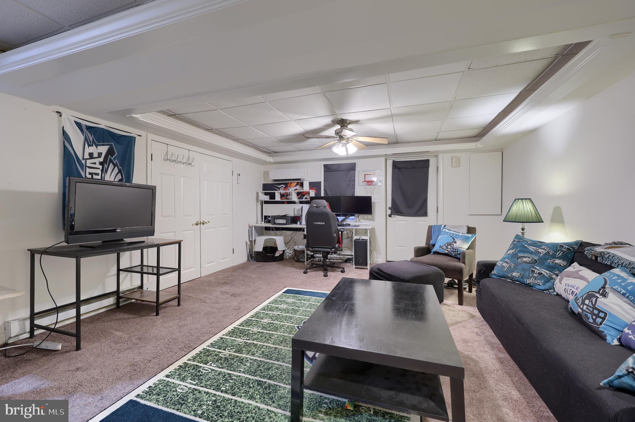 425 Cardinal Road Lititz, PA 17543 - Photo 31 of 33 a living room with furniture a flat screen tv and kitchen view
