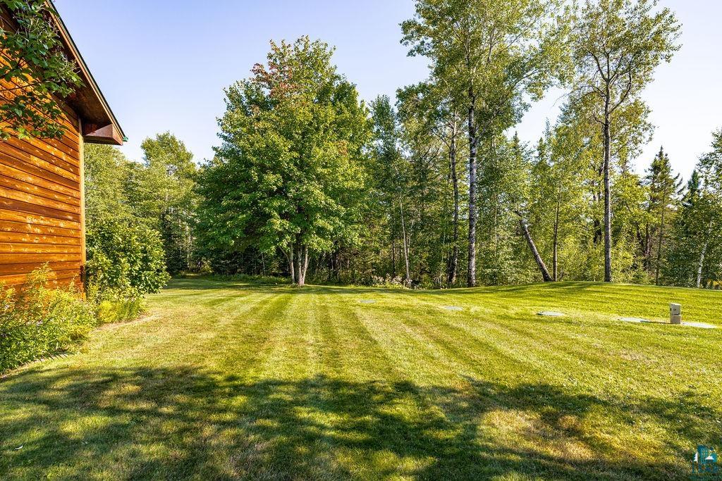 5370 Ugstad Road Hermantown, MN 55811 - Photo 61 of 68 Expansive manicured lawn with mature trees and natural surroundings