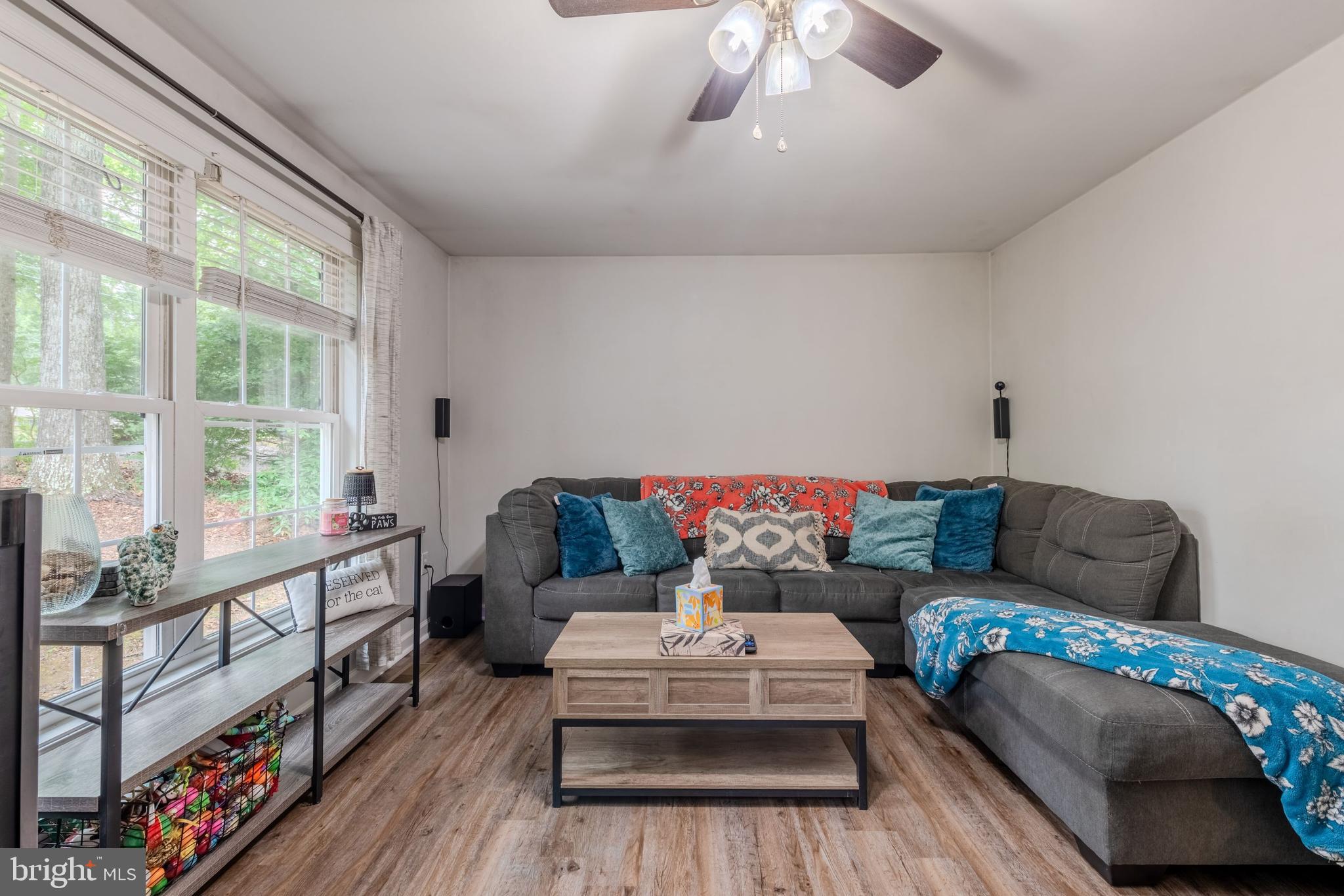 668 Running Fox Road Lusby, MD 20657 - Photo 6 of 12 a living room with furniture and a large window