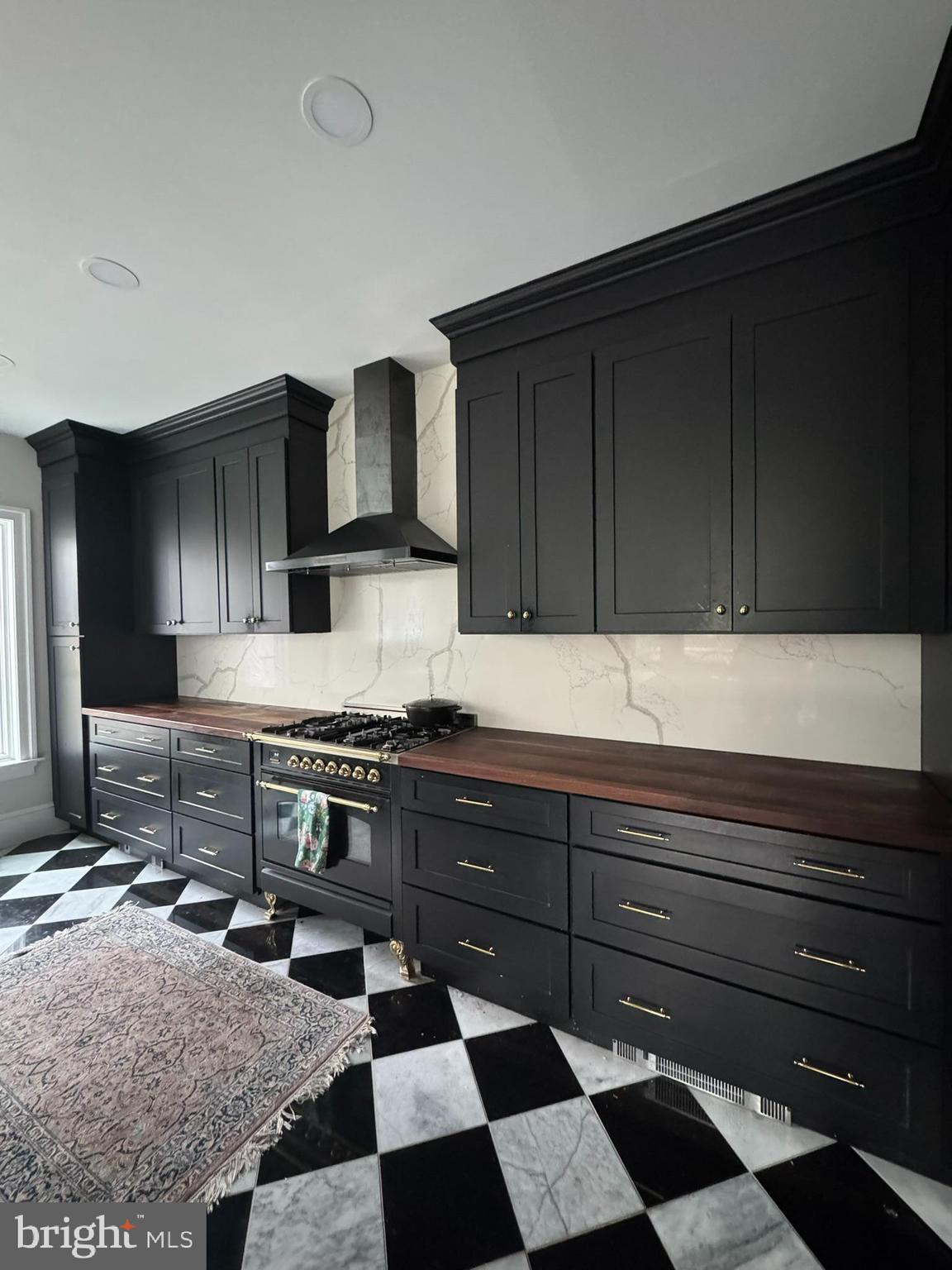 731 Yale Avenue Swarthmore, PA 19081 - Photo 11 of 35 a kitchen with granite countertop stainless steel appliances a sink and cabinets