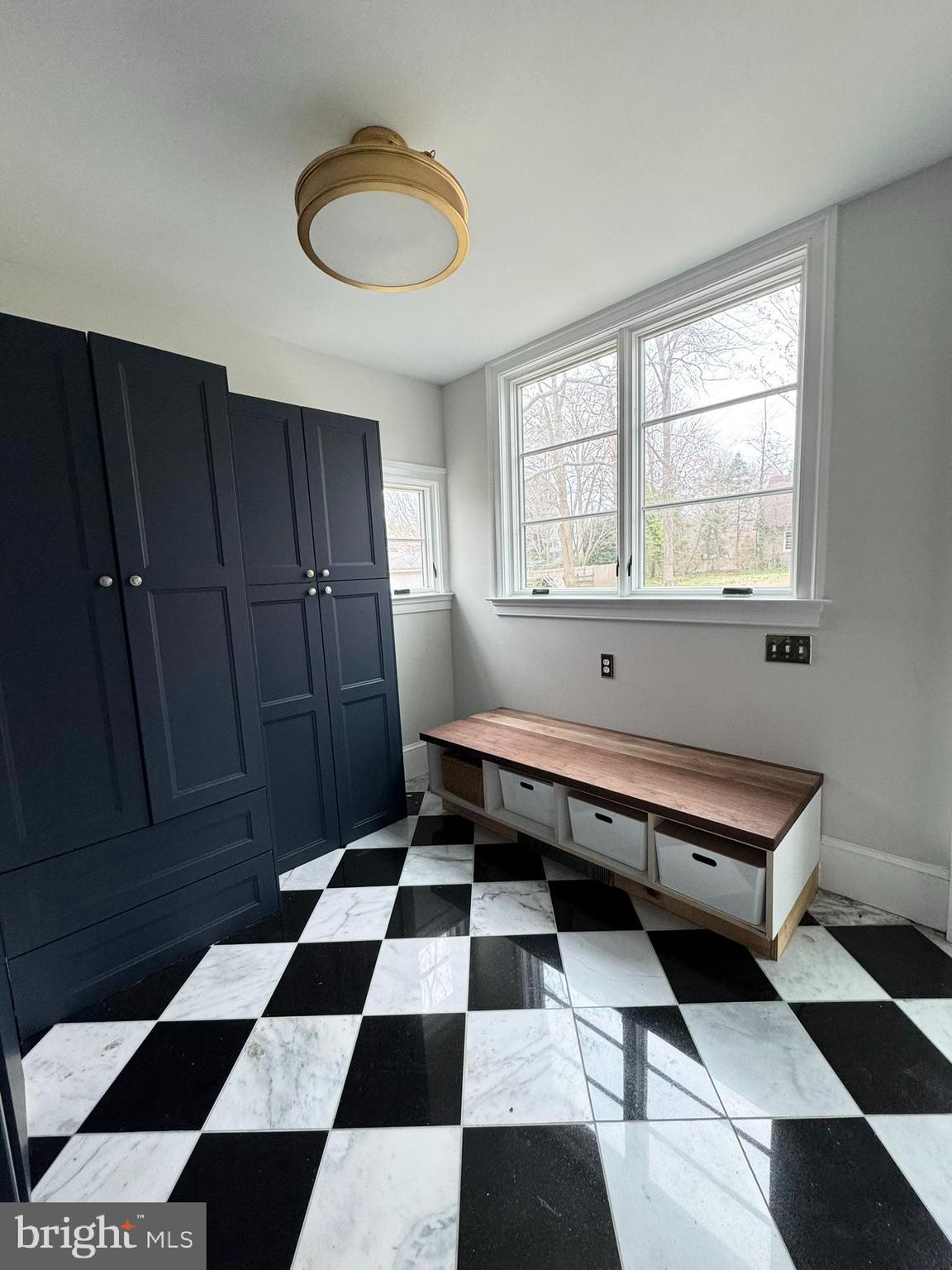 731 Yale Avenue Swarthmore, PA 19081 - Photo 12 of 35 a room with a black white checkered floor with a black white checkered floor and a coffee table