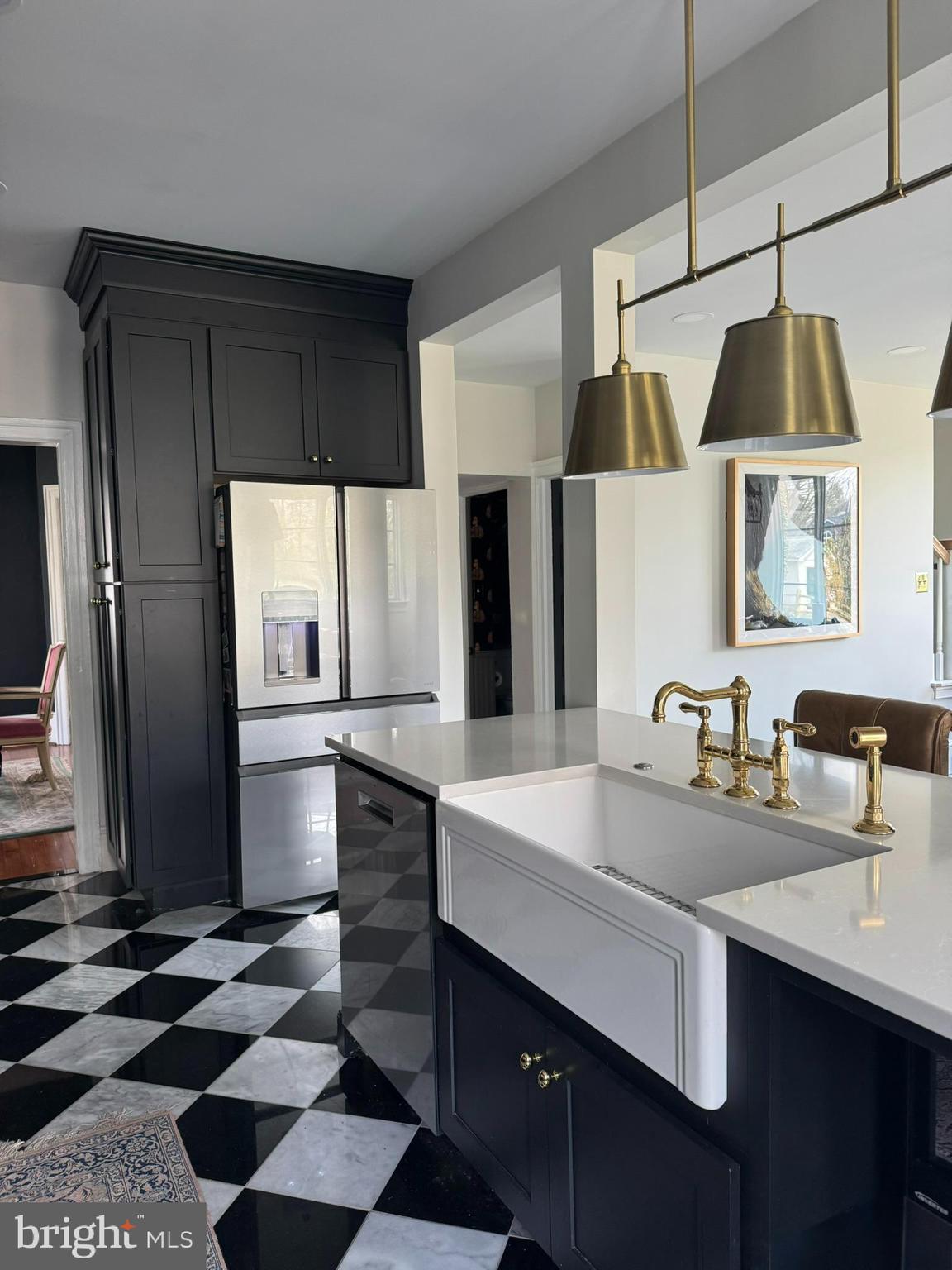 731 Yale Avenue Swarthmore, PA 19081 - Photo 14 of 35 a kitchen with a sink a refrigerator and cabinets
