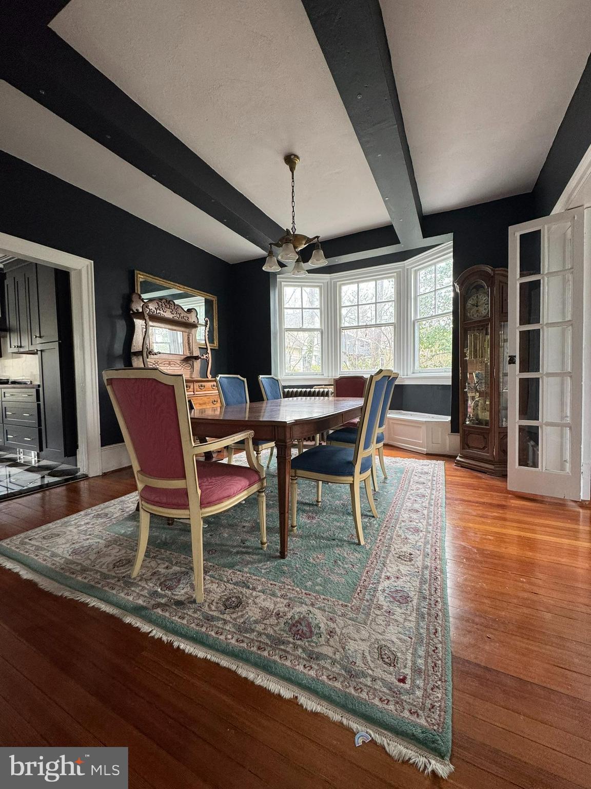 731 Yale Avenue Swarthmore, PA 19081 - Photo 15 of 35 a dining room with furniture a rug and wooden floor