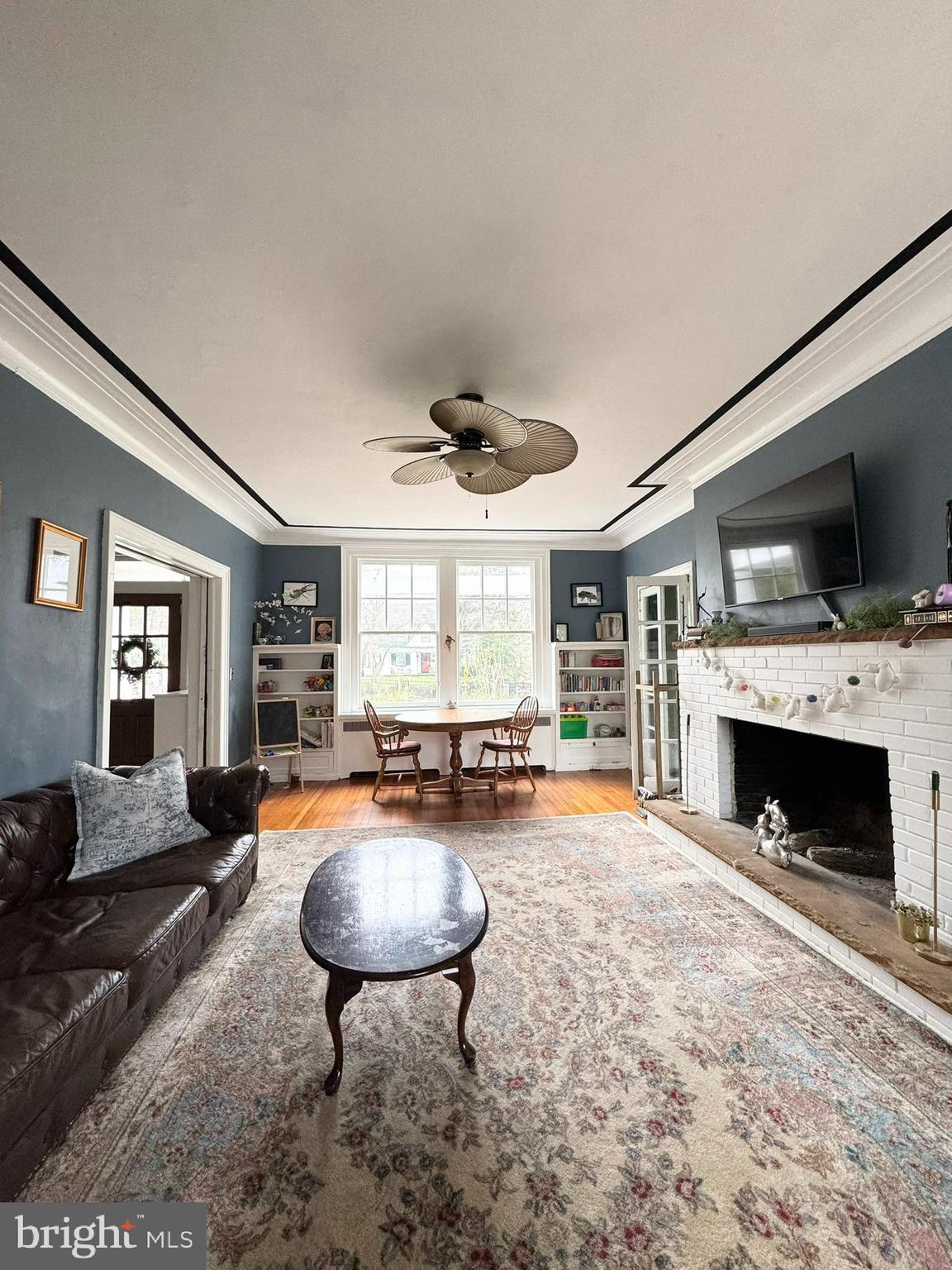 731 Yale Avenue Swarthmore, PA 19081 - Photo 18 of 35 a living room with furniture and a fireplace