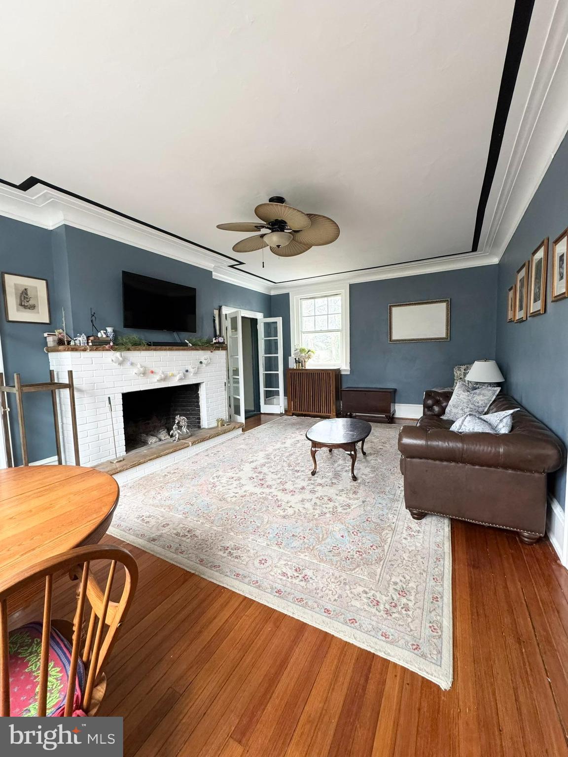 731 Yale Avenue Swarthmore, PA 19081 - Photo 19 of 35 a living room with furniture and a fireplace