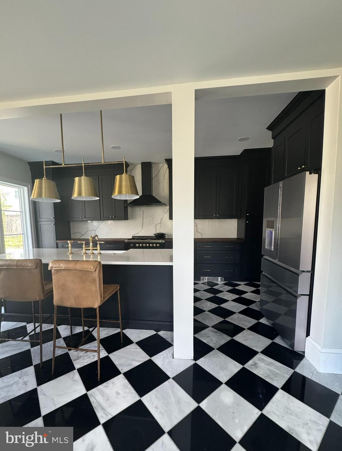 731 Yale Avenue Swarthmore, PA 19081 - Photo 9 of 35 a kitchen with a checkered floor and a stove top oven