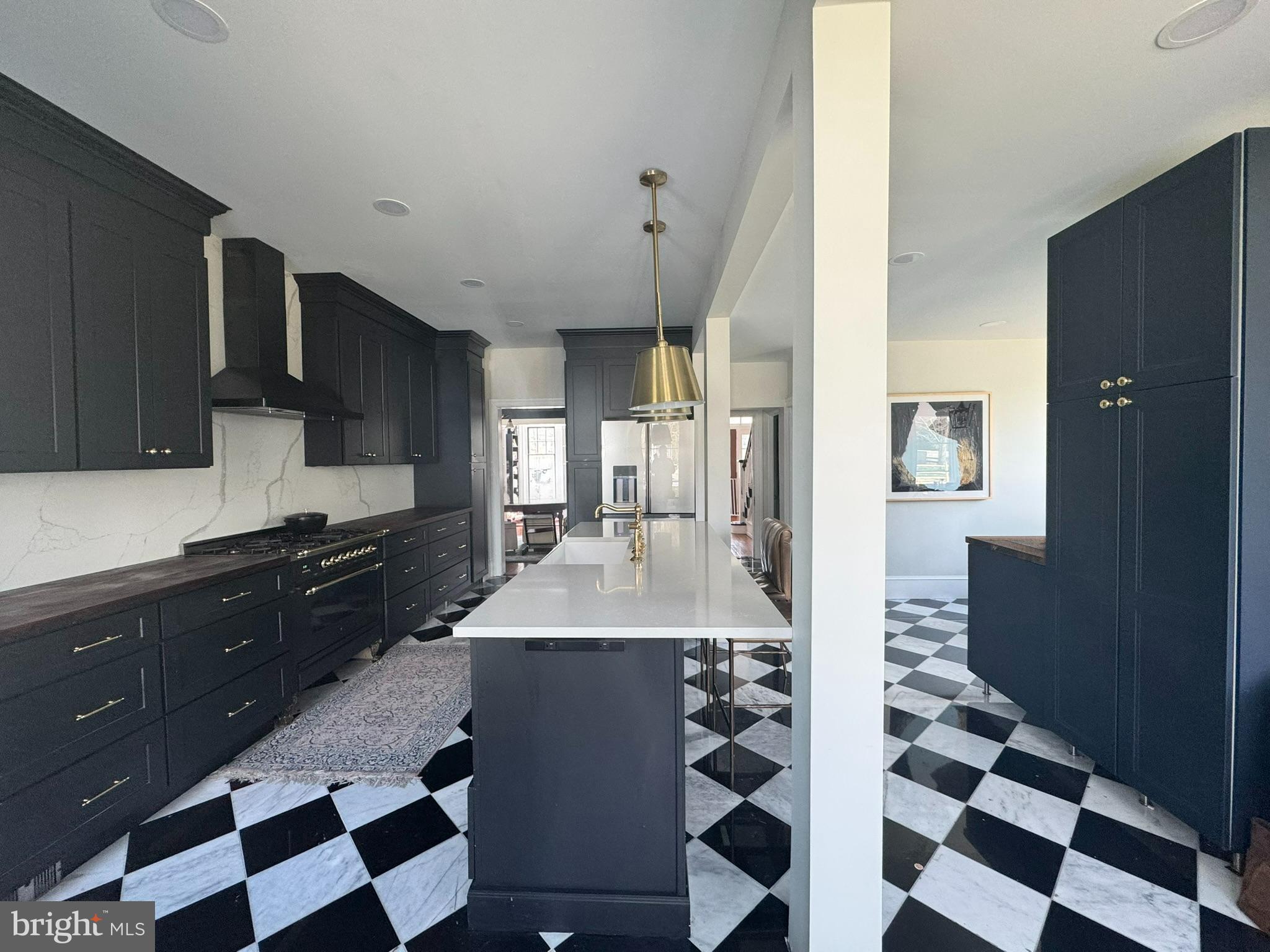 731 Yale Avenue Swarthmore, PA 19081 - Photo 10 of 35 a large kitchen with stainless steel appliances a sink and a refrigerator