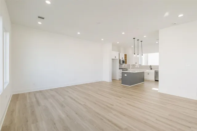 a view of kitchen and kitchen with sink