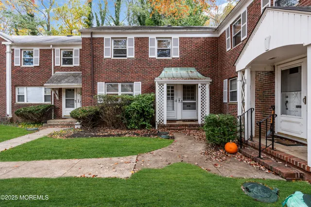 a backyard of a house with seating space and porch