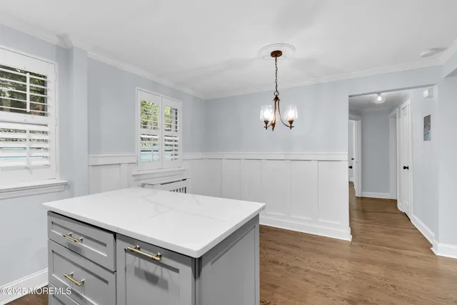 a kitchen that has a sink a stove and a window