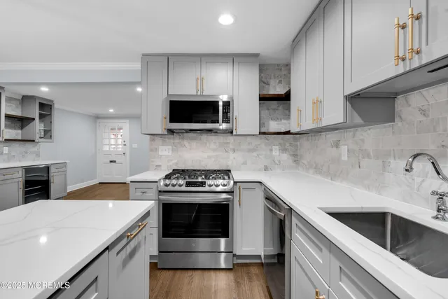 a kitchen with a stove and a microwave