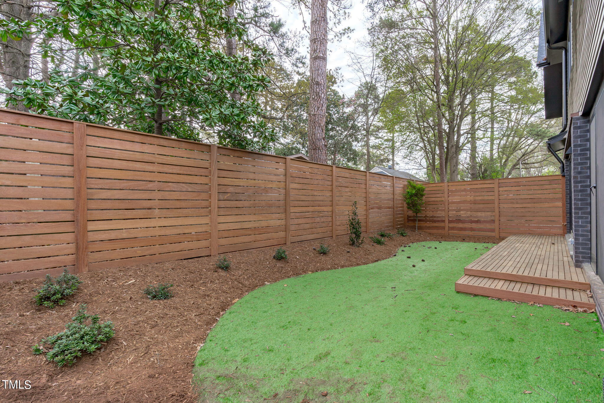 1406 Lyon Street, Unit 102 Raleigh, NC 27608 - Photo 11 of 57 a view of a back yard