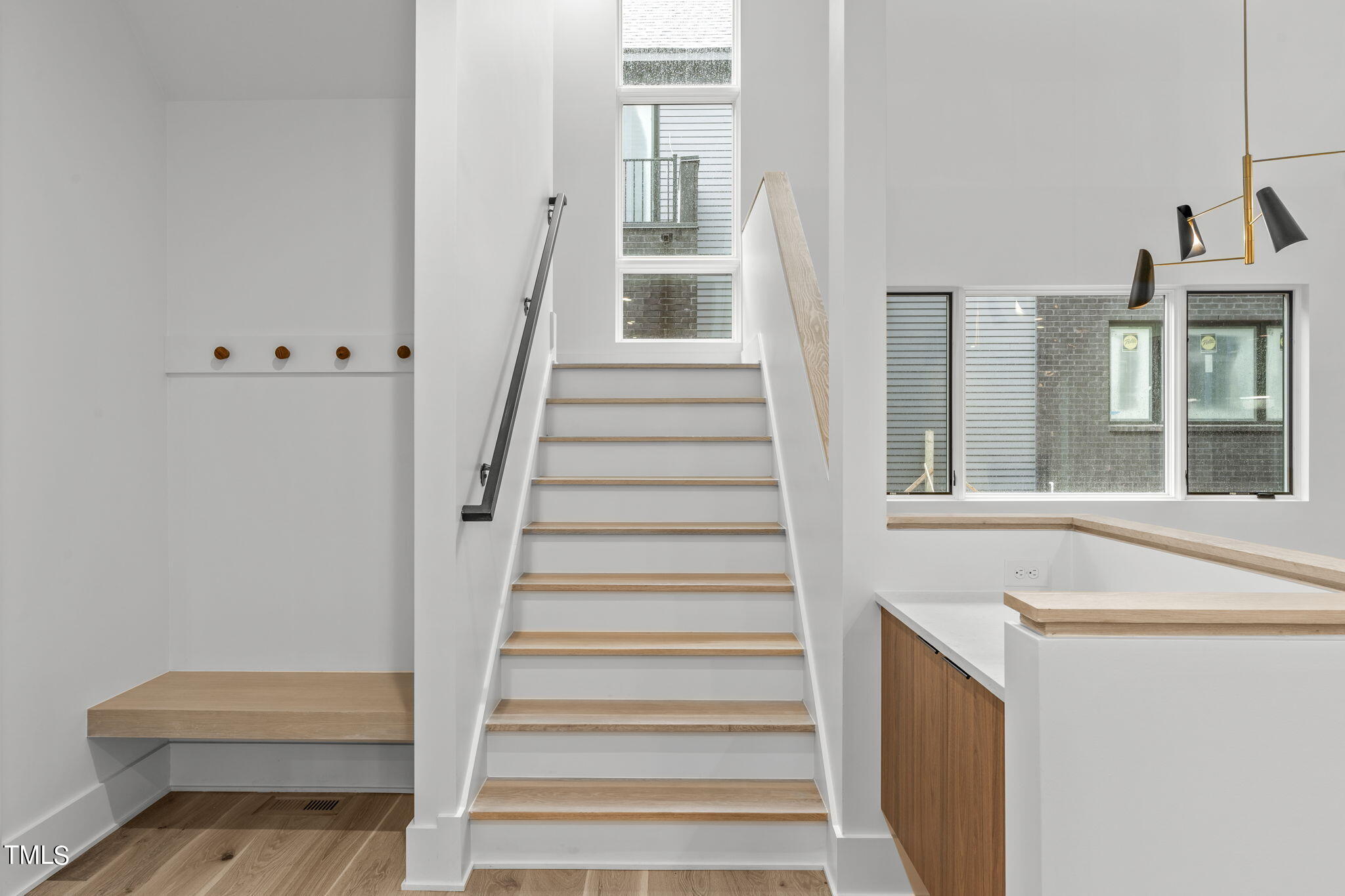 1406 Lyon Street, Unit 102 Raleigh, NC 27608 - Photo 16 of 57 a view of entryway and hall with wooden floor