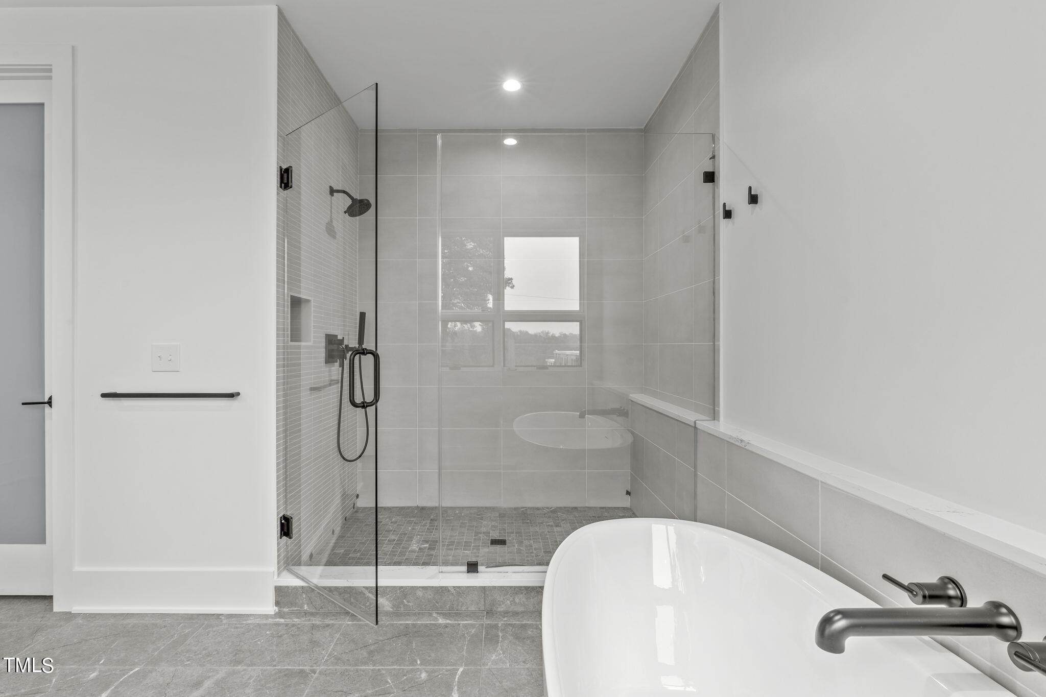 1406 Lyon Street, Unit 102 Raleigh, NC 27608 - Photo 22 of 57 a bathroom with a shower