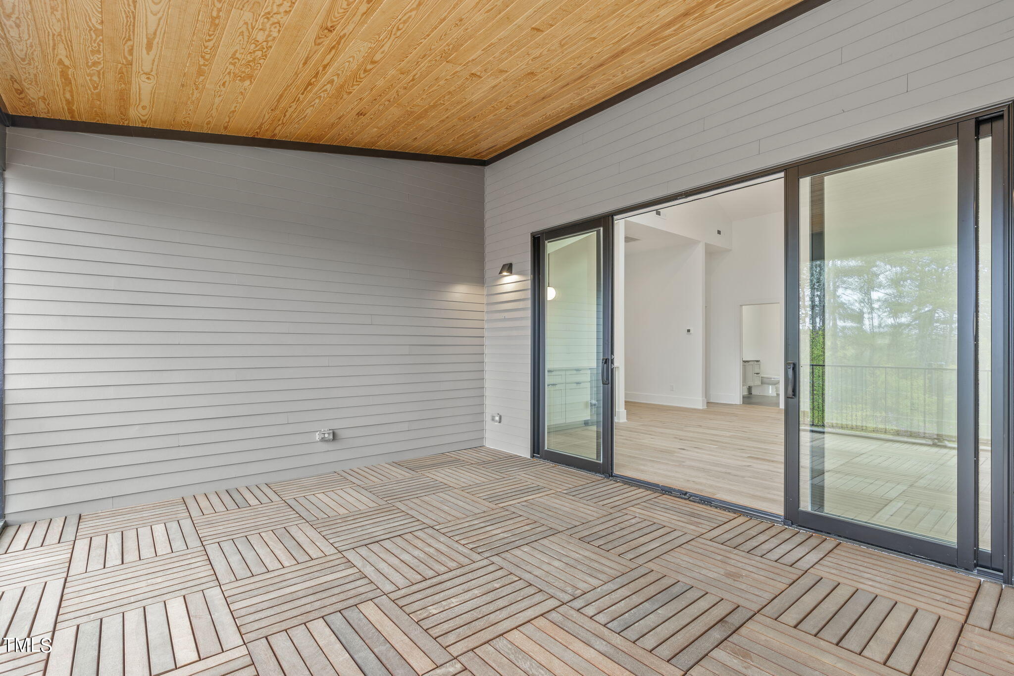 1406 Lyon Street, Unit 102 Raleigh, NC 27608 - Photo 34 of 57 a view of an empty room and glass door
