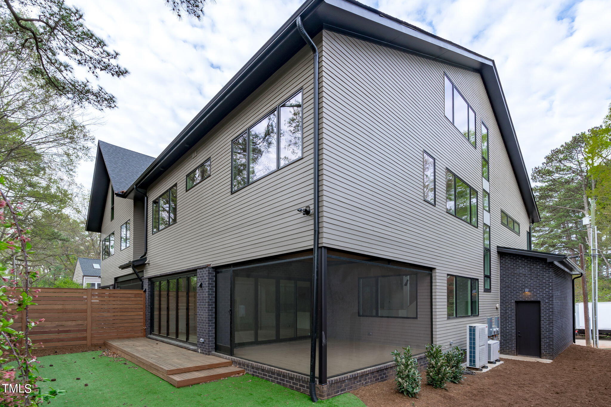 1406 Lyon Street, Unit 102 Raleigh, NC 27608 - Photo 41 of 57 a view of a house with a yard
