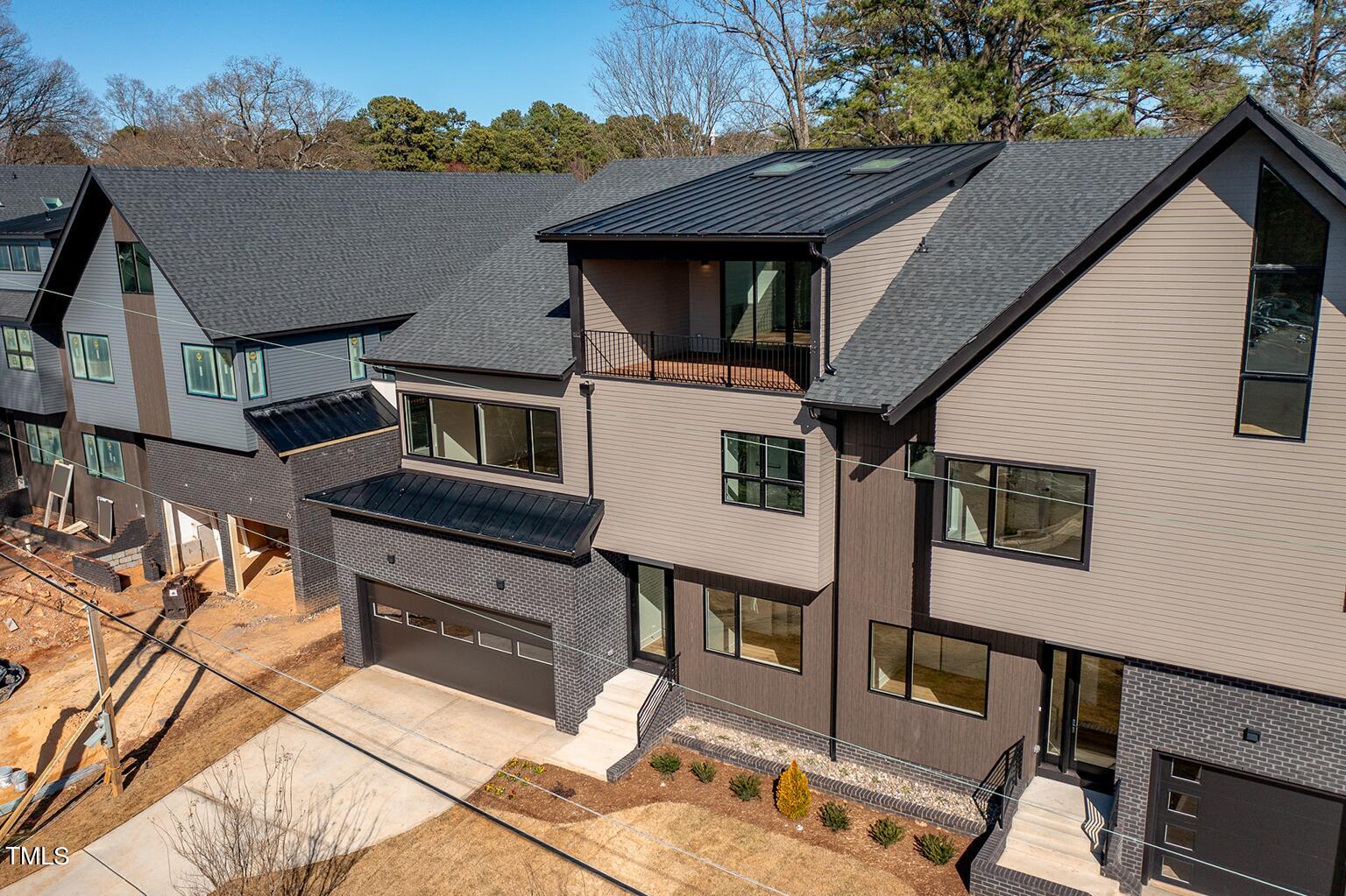 1406 Lyon Street, Unit 102 Raleigh, NC 27608 - Photo 42 of 57 a front view of a house with a yard