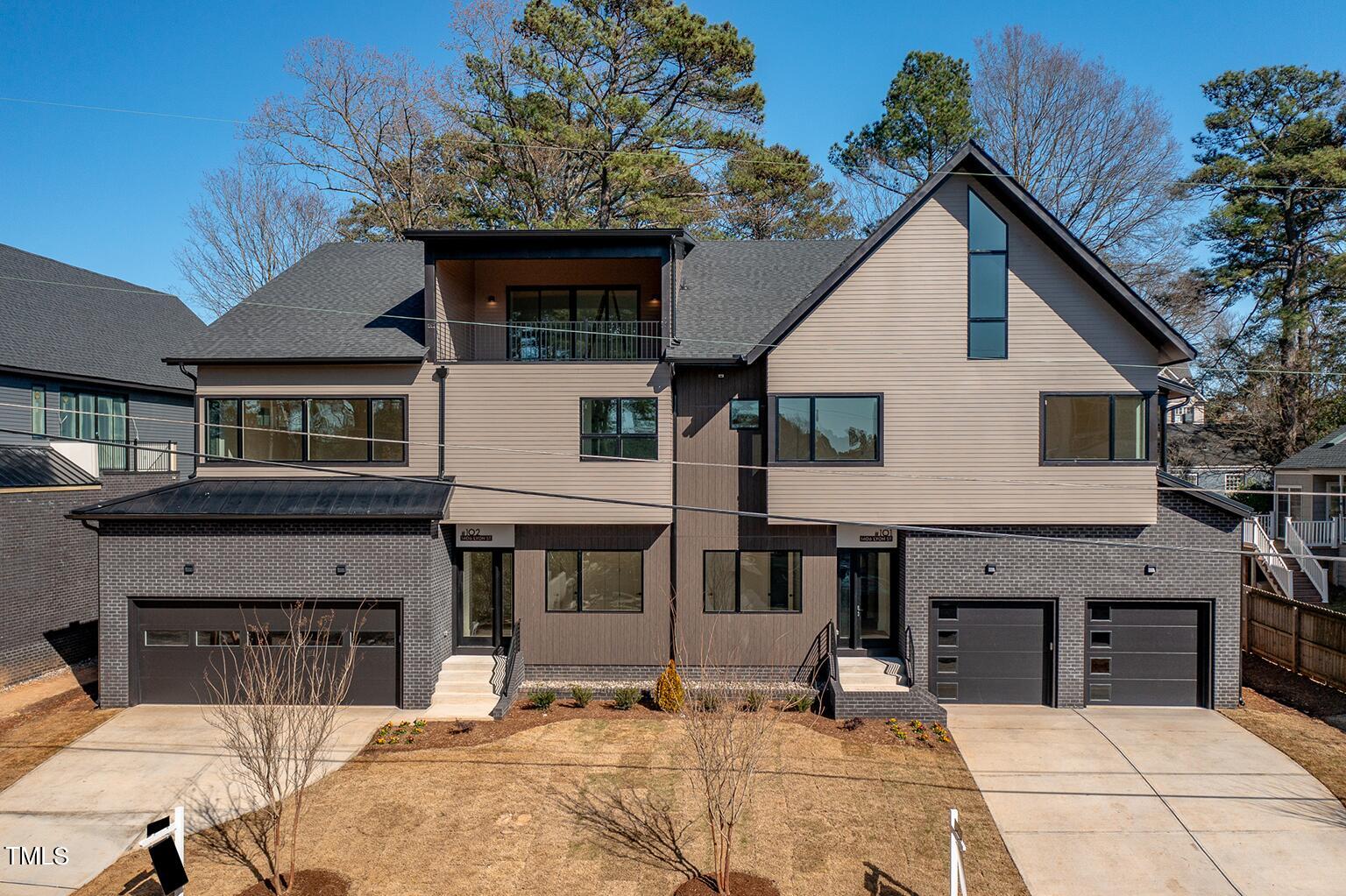 1406 Lyon Street, Unit 102 Raleigh, NC 27608 - Photo 43 of 57 a view of a house with roof and sitting area