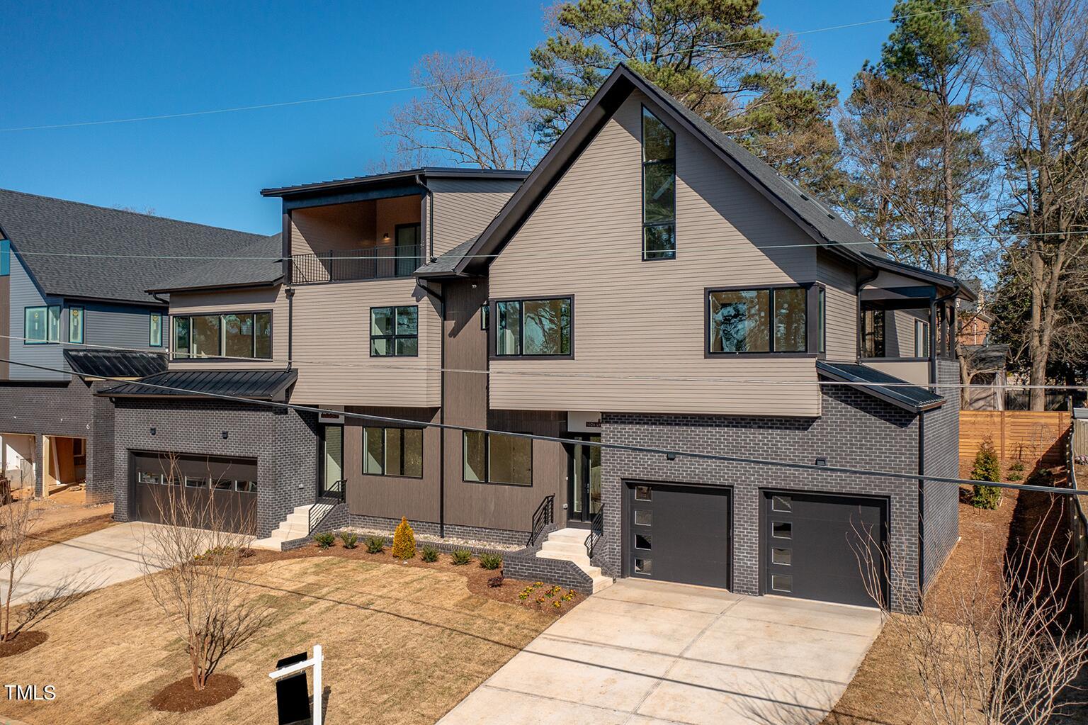 1406 Lyon Street, Unit 102 Raleigh, NC 27608 - Photo 45 of 57 a view of a house with wooden deck and furniture