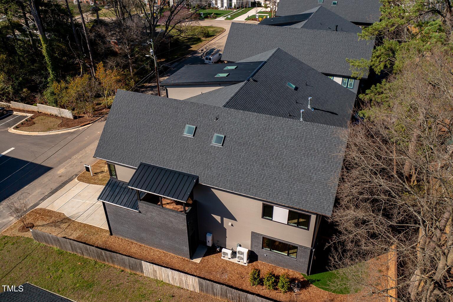 1406 Lyon Street, Unit 102 Raleigh, NC 27608 - Photo 46 of 57 an aerial view of house with backyard