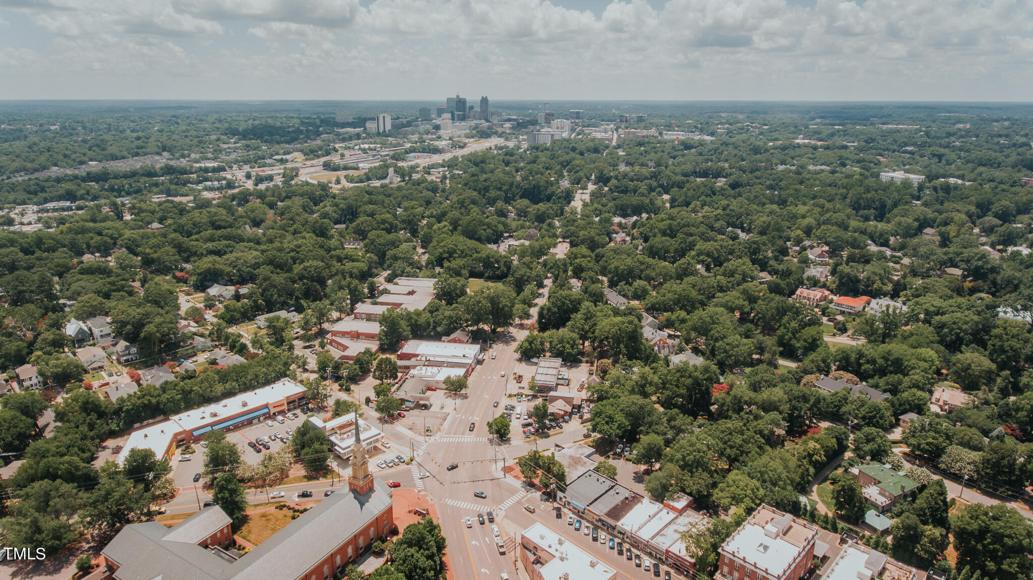 1406 Lyon Street, Unit 102 Raleigh, NC 27608 - Photo 53 of 57 an aerial view of a city with lots of residential buildings