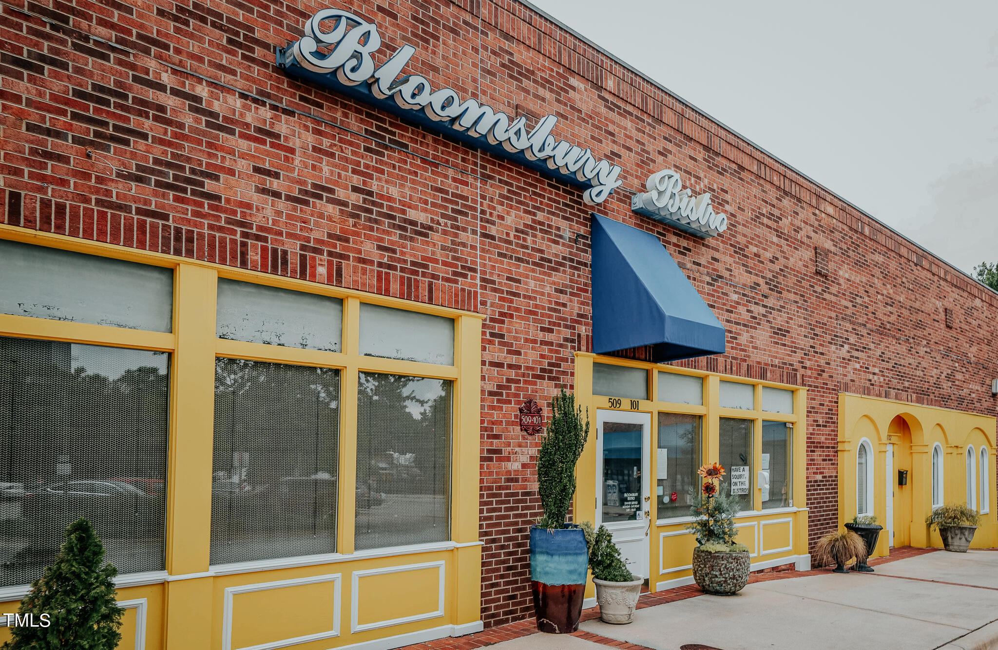 1406 Lyon Street, Unit 102 Raleigh, NC 27608 - Photo 54 of 57 a view of a building with a large window
