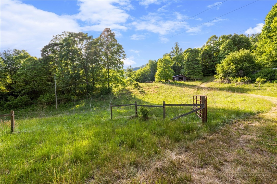 Heg Greene Road Deep Gap, NC 28618 - Photo 1 of 5 a swimming pool with outdoor seating and green space