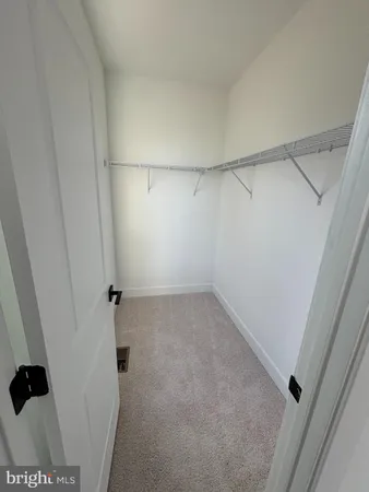 a view of a room with racks on the wall