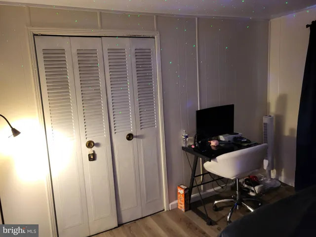 a workspace with furniture and wooden floor