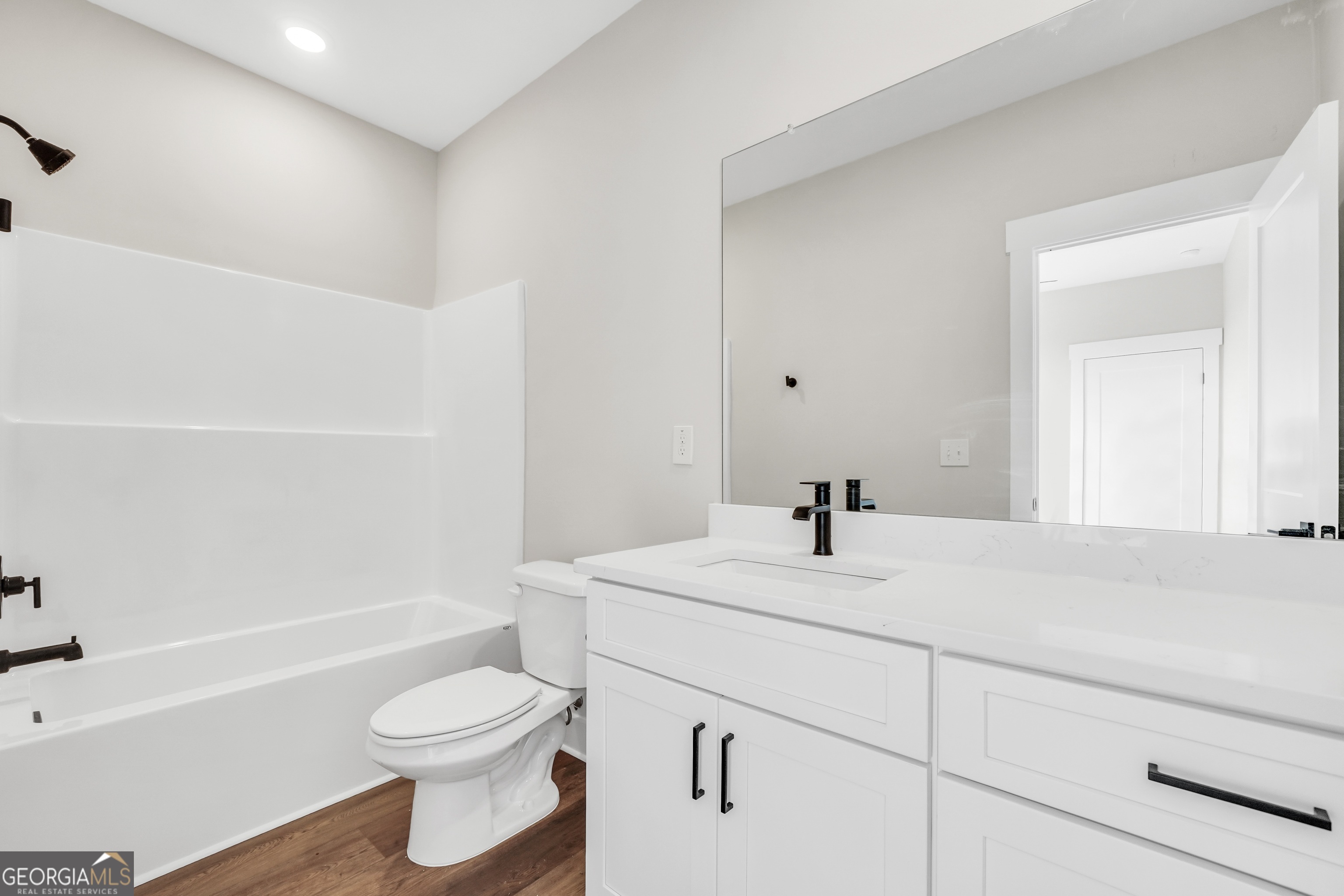 277 East Knight Road McDonough, GA 30252 - Photo 17 of 23 a bathroom with a sink a toilet and a bathtub