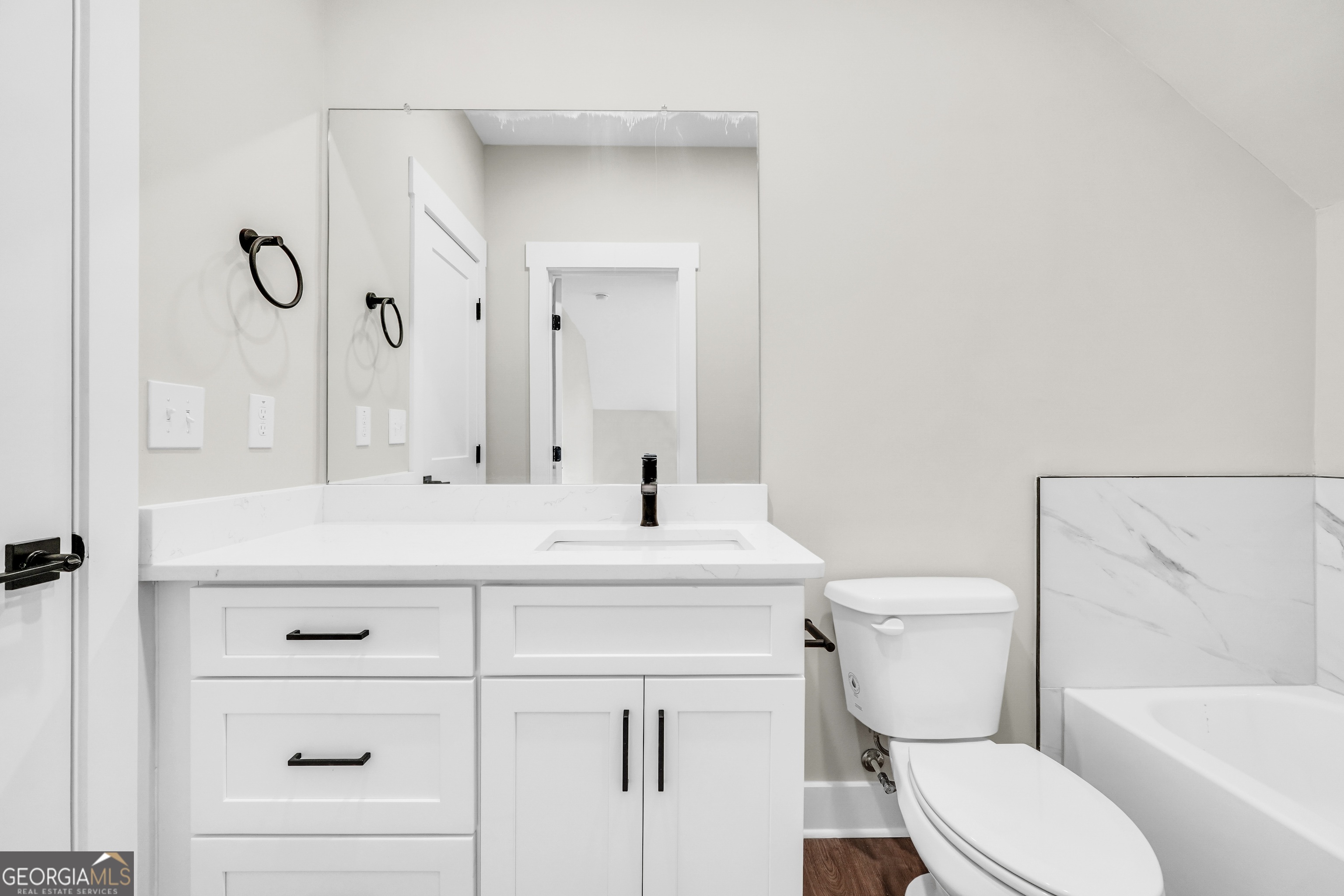 277 East Knight Road McDonough, GA 30252 - Photo 18 of 23 a bathroom with a sink a toilet and shower