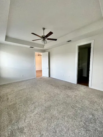 a view of a big room with carpet