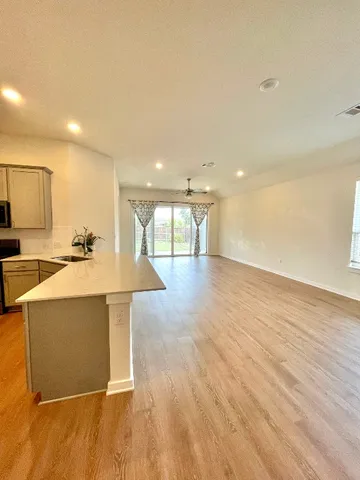 a view of a houses with a street