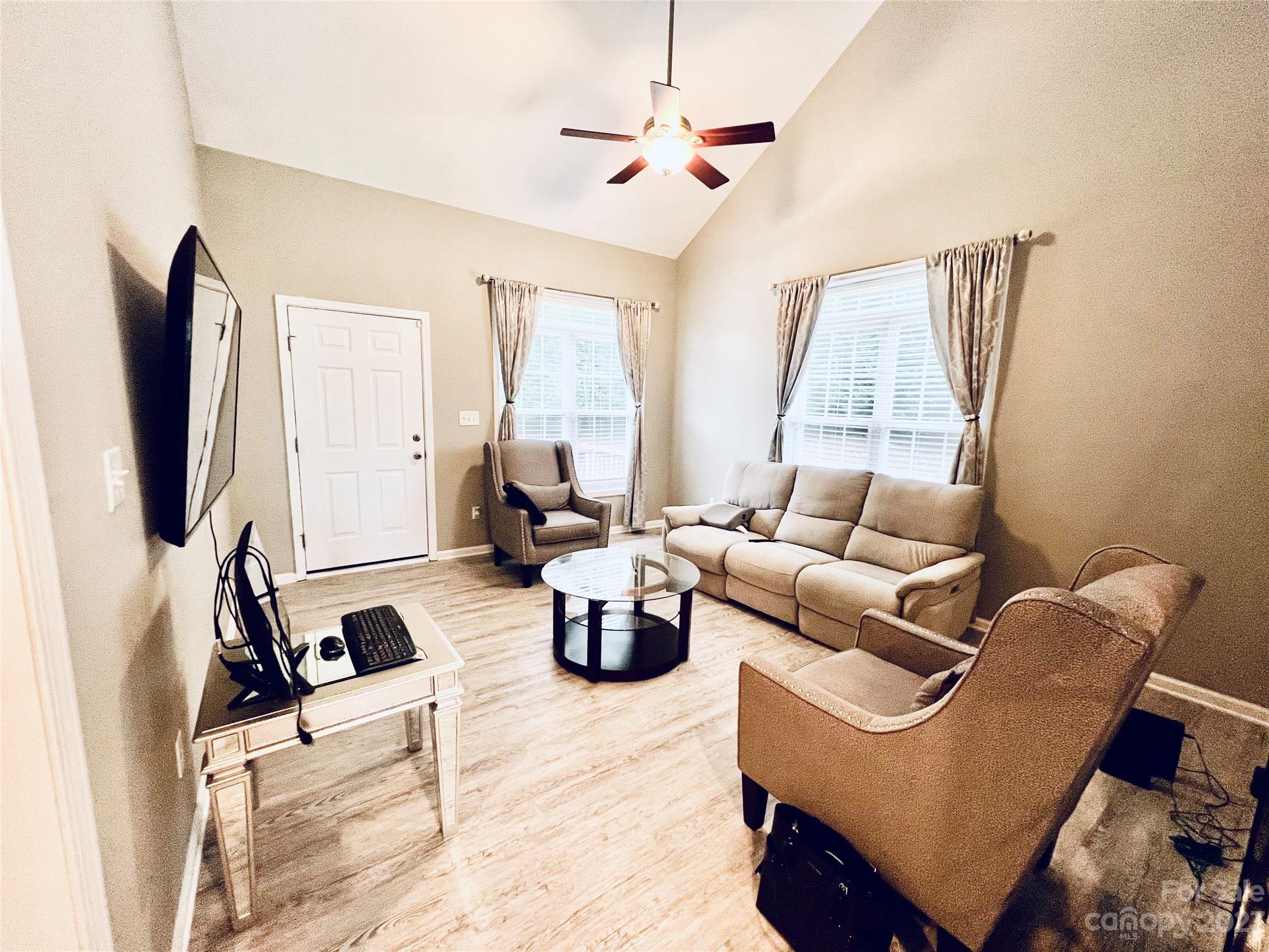 117 Forest Ridge Road Mooresville, NC 28117 - Photo 18 of 40 a living room with furniture and a flat screen tv