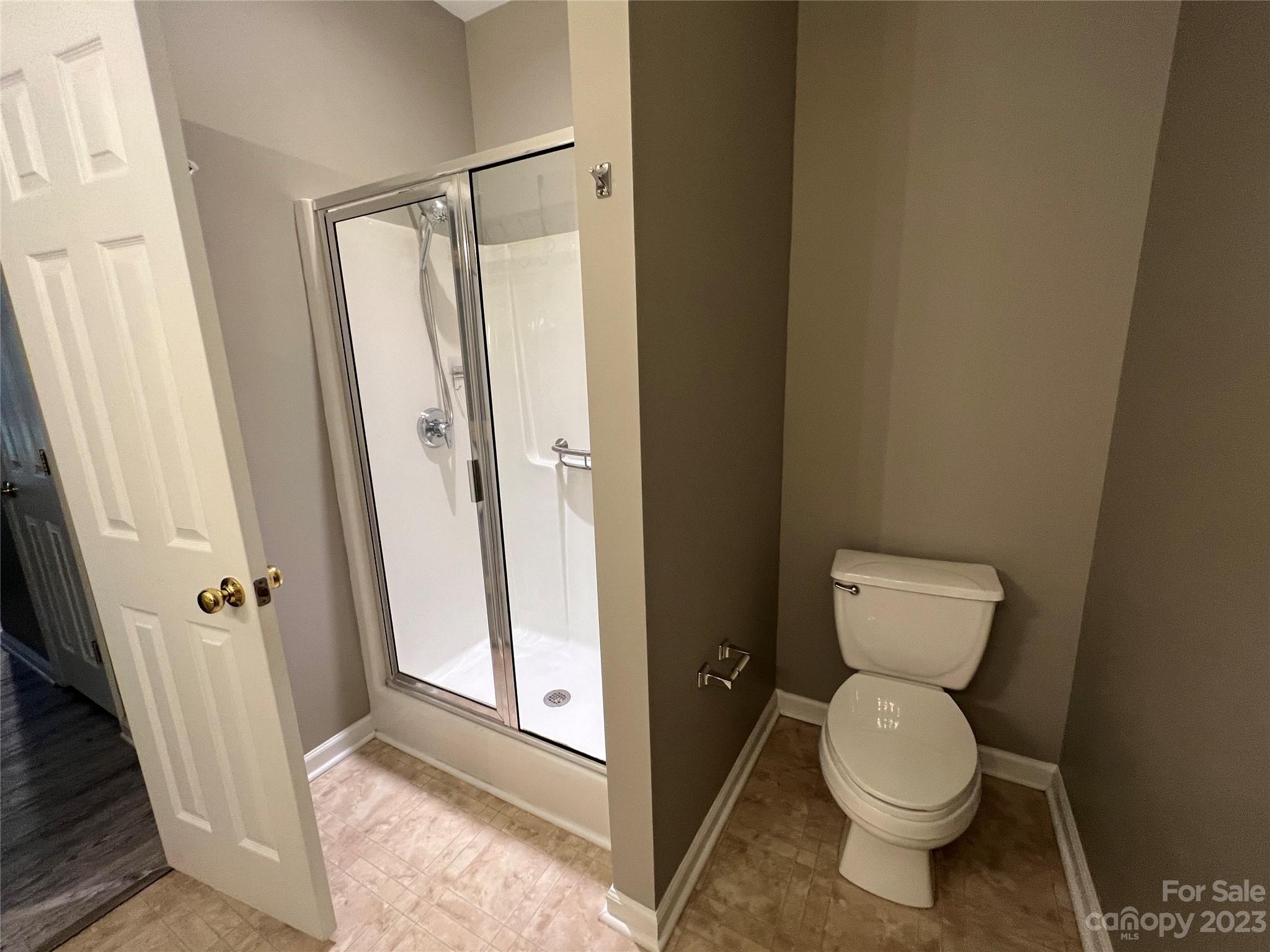 117 Forest Ridge Road Mooresville, NC 28117 - Photo 28 of 40 a bathroom with a toilet and a shower