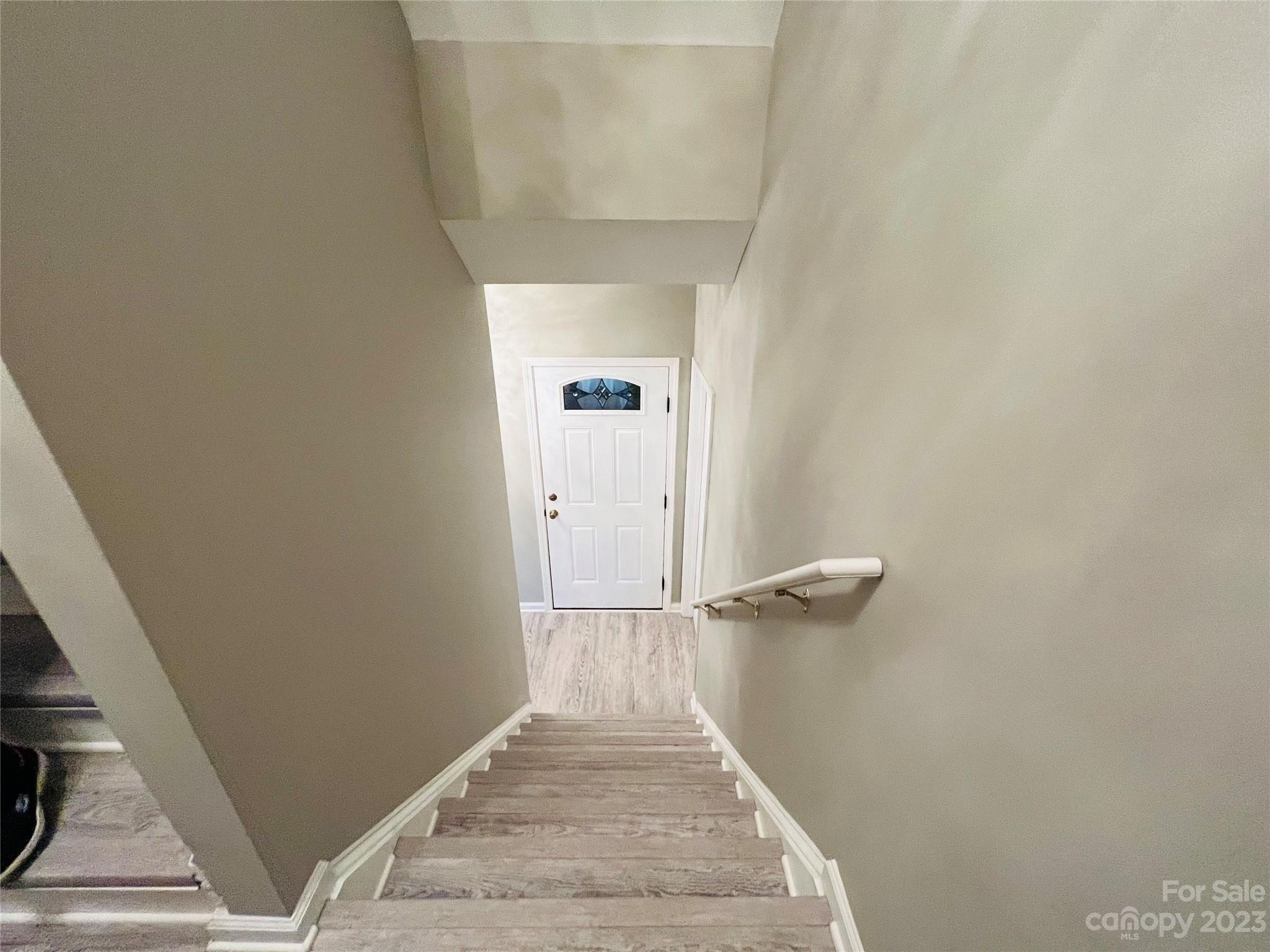 117 Forest Ridge Road Mooresville, NC 28117 - Photo 34 of 40 a view of a hallway with wooden floor and a staircase
