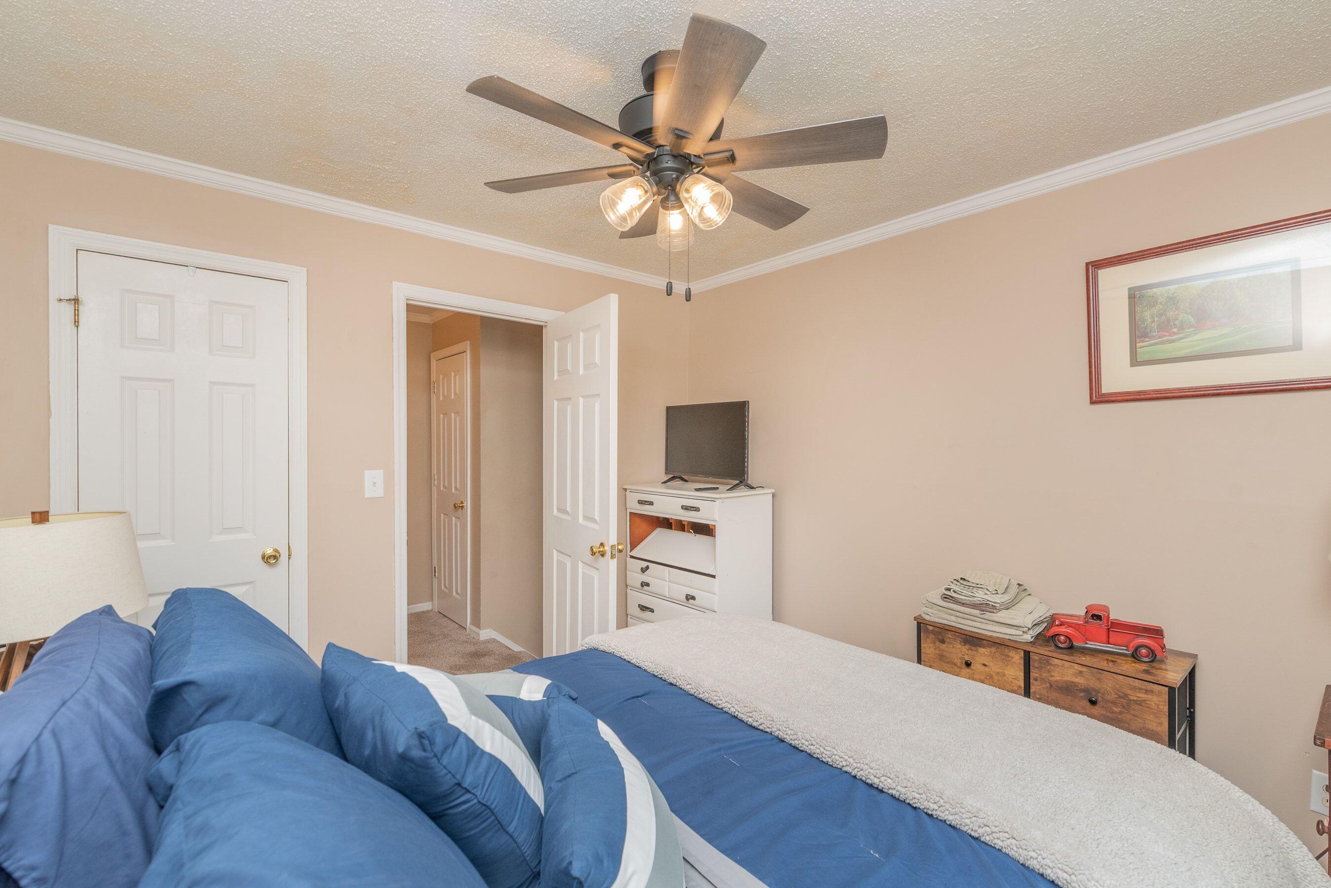 1117 Ridgemont Drive Aiken, SC 29803 - Photo 22 of 49 a bedroom with a bed and a flat screen tv