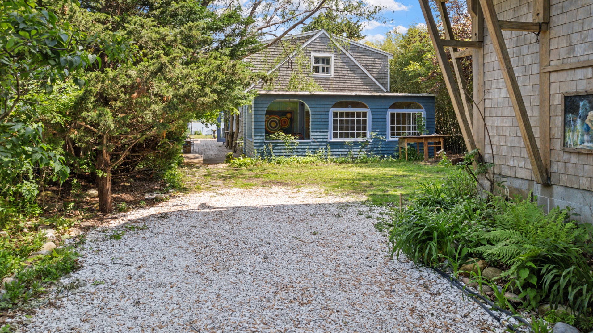 129 Beach Road Vineyard Haven, MA 02568 - Photo 17 of 71 a front view of a house with a yard
