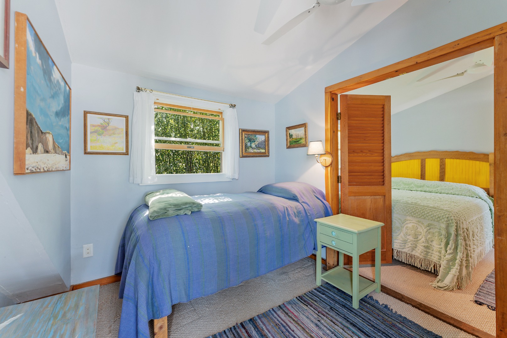 129 Beach Road Vineyard Haven, MA 02568 - Photo 35 of 71 a bedroom with a bed and wooden floor