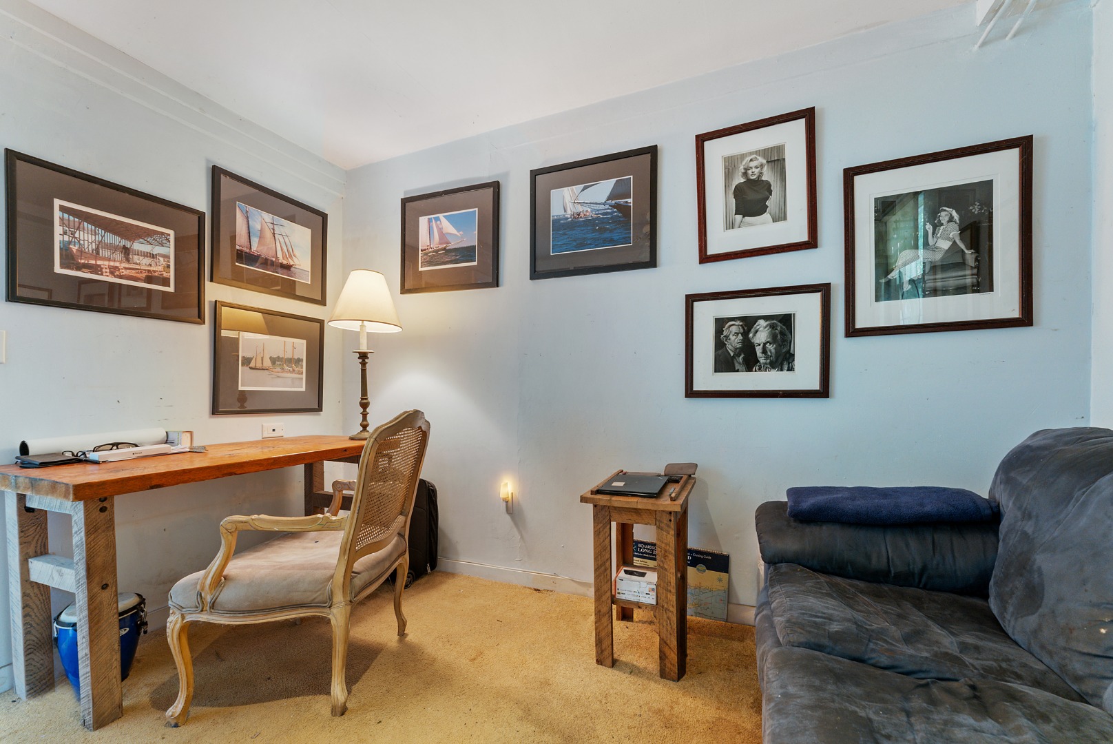 129 Beach Road Vineyard Haven, MA 02568 - Photo 37 of 71 a room with furniture and paintings on the wall