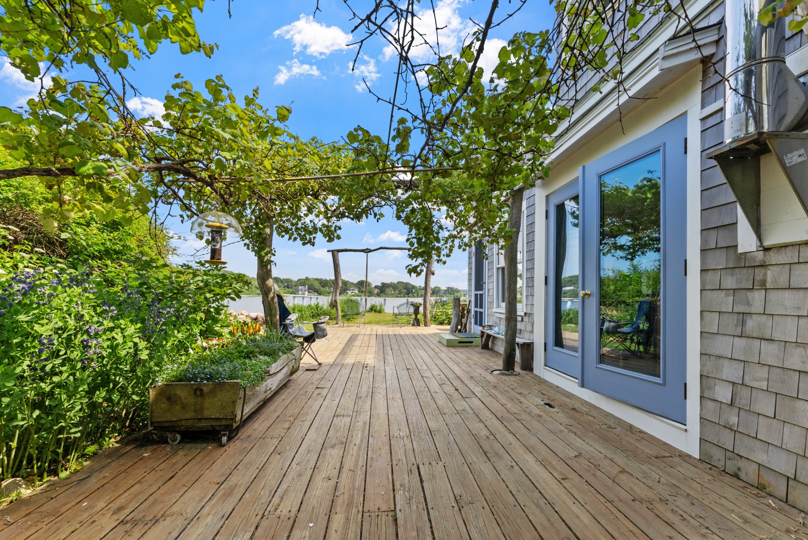 129 Beach Road Vineyard Haven, MA 02568 - Photo 50 of 71 a view of a house with backyard and sitting area