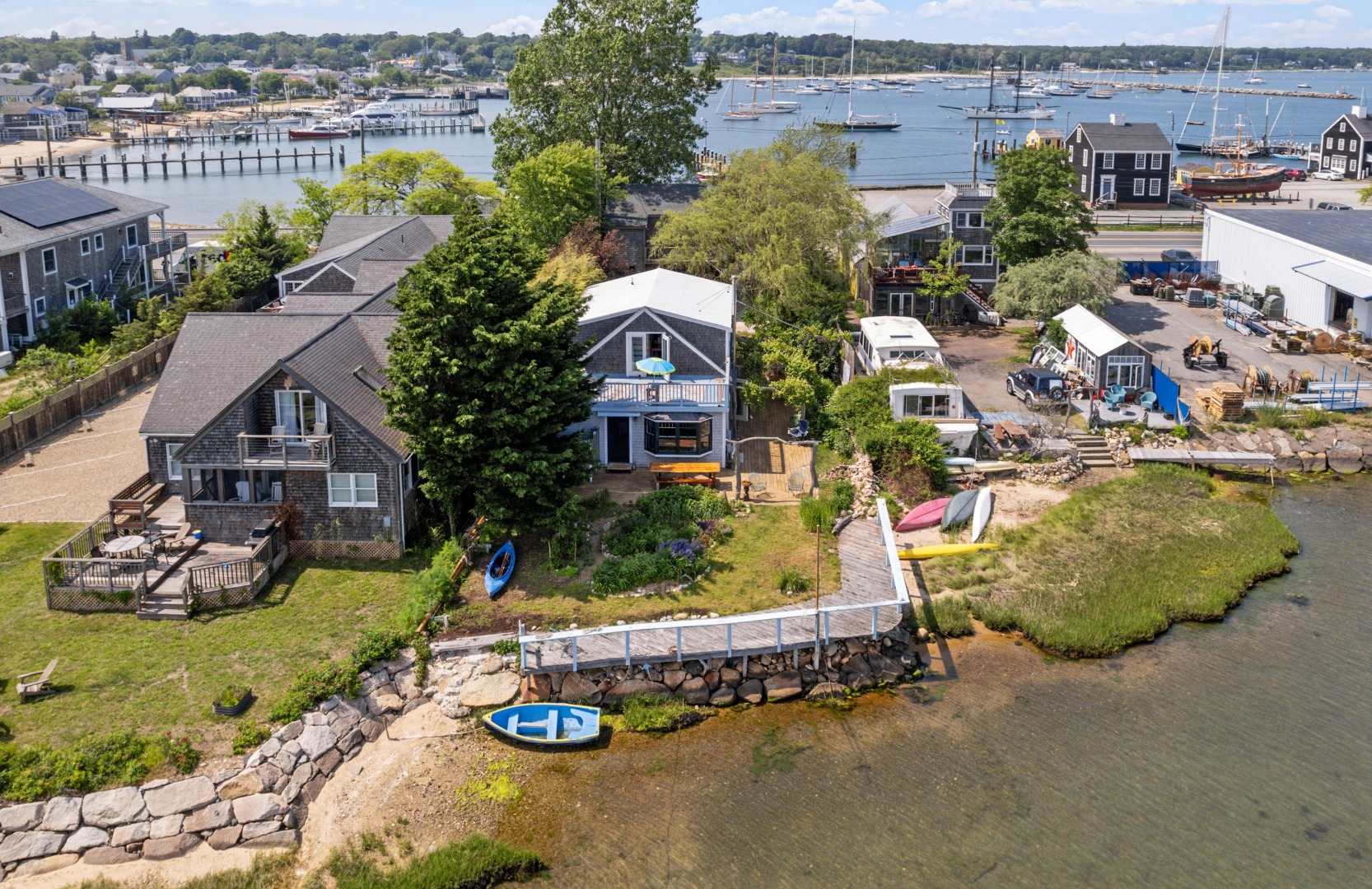 129 Beach Road Vineyard Haven, MA 02568 - Photo 5 of 71 an aerial view of a house with a garden and lake view