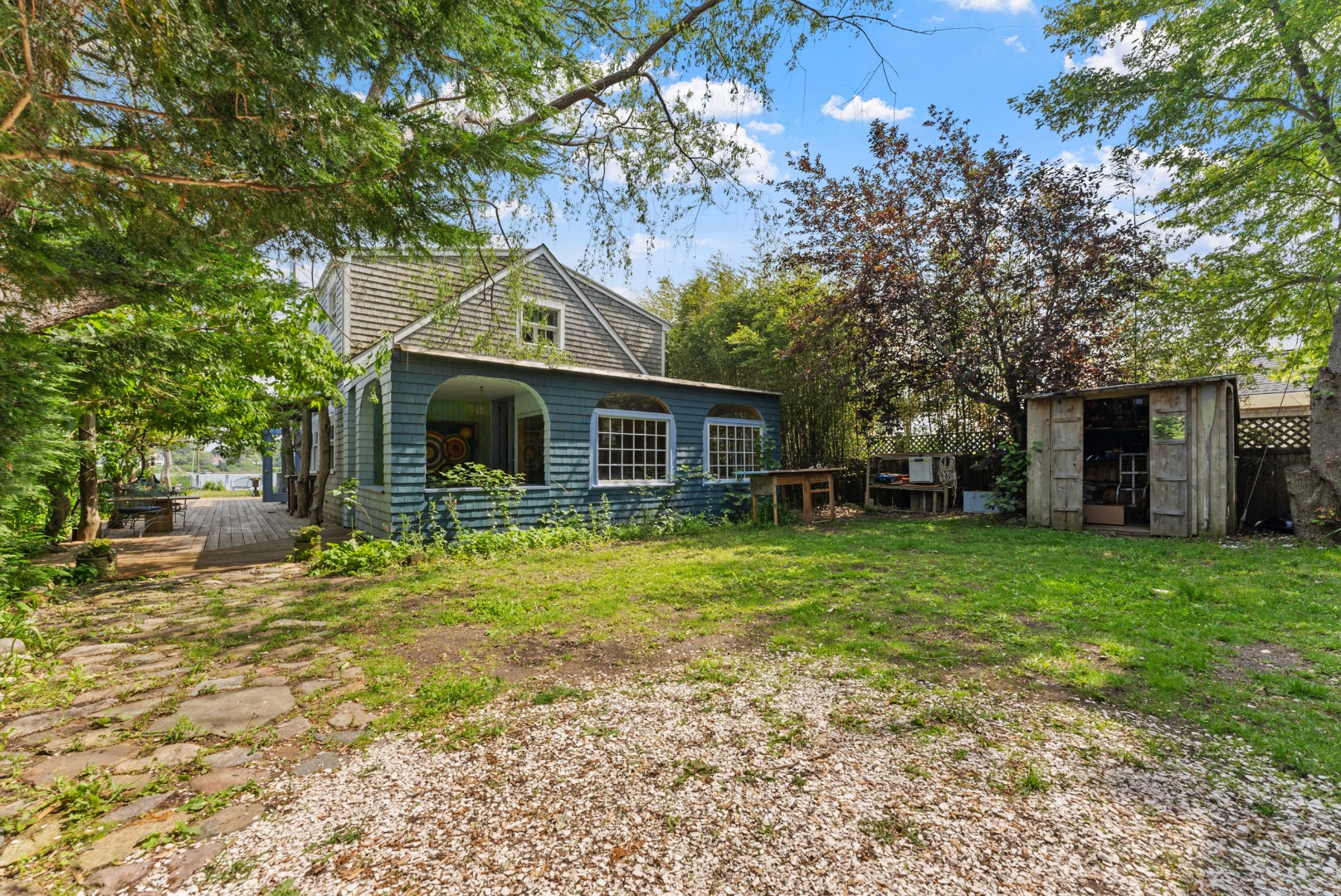 129 Beach Road Vineyard Haven, MA 02568 - Photo 56 of 71 a front view of a house with a garden