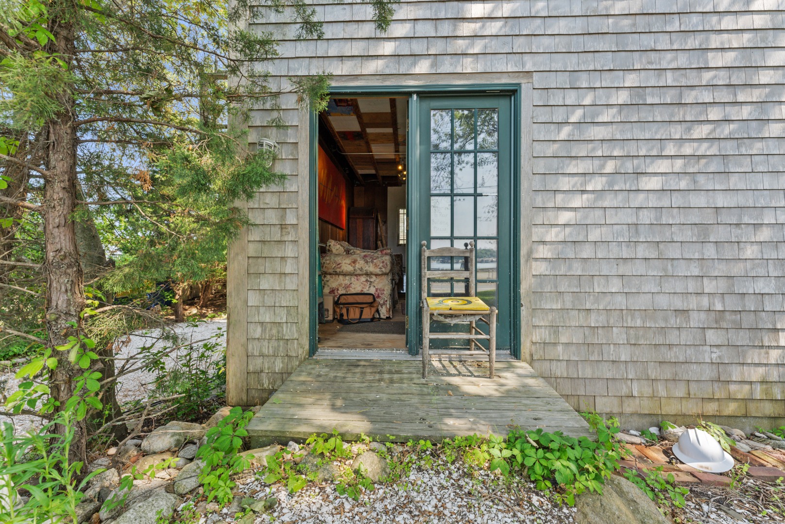 129 Beach Road Vineyard Haven, MA 02568 - Photo 57 of 71 a front view of a house with a yard