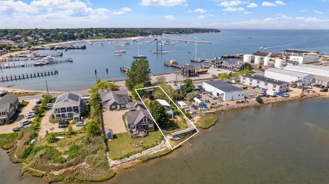 a view of a balcony with wooden floor and iron fence