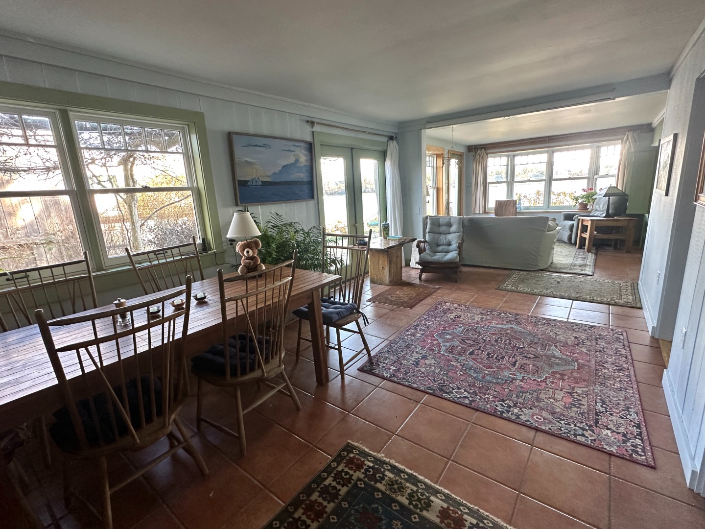 129 Beach Road Vineyard Haven, MA 02568 - Photo 68 of 71 a view of a dining room with furniture wooden floor and a rug