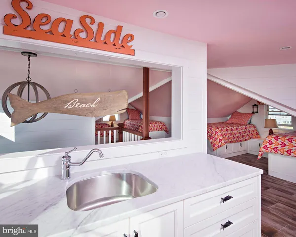 a kitchen with a sink and a refrigerator